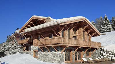 Photographie en image de synthèse d'un chalet de luxe à la montagne.